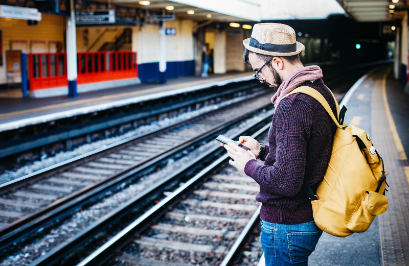 photo of commuter using phone